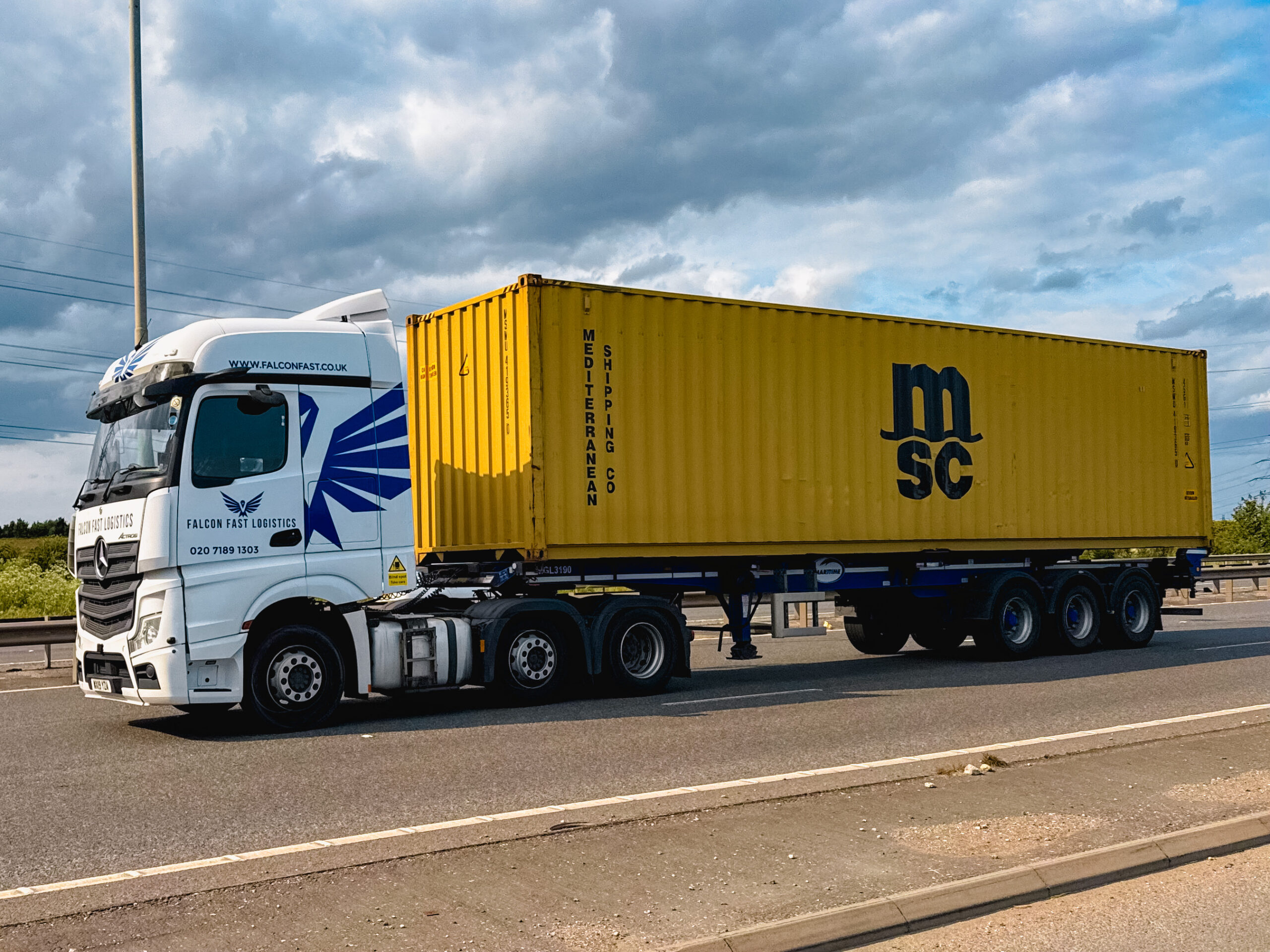 Falcon Fast Logistics truck on the motorway