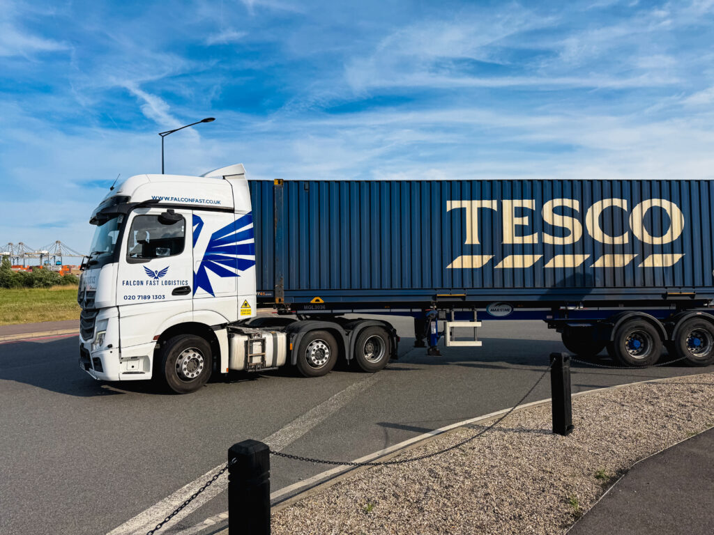 Falcon Fast Logistics truck hauling a container