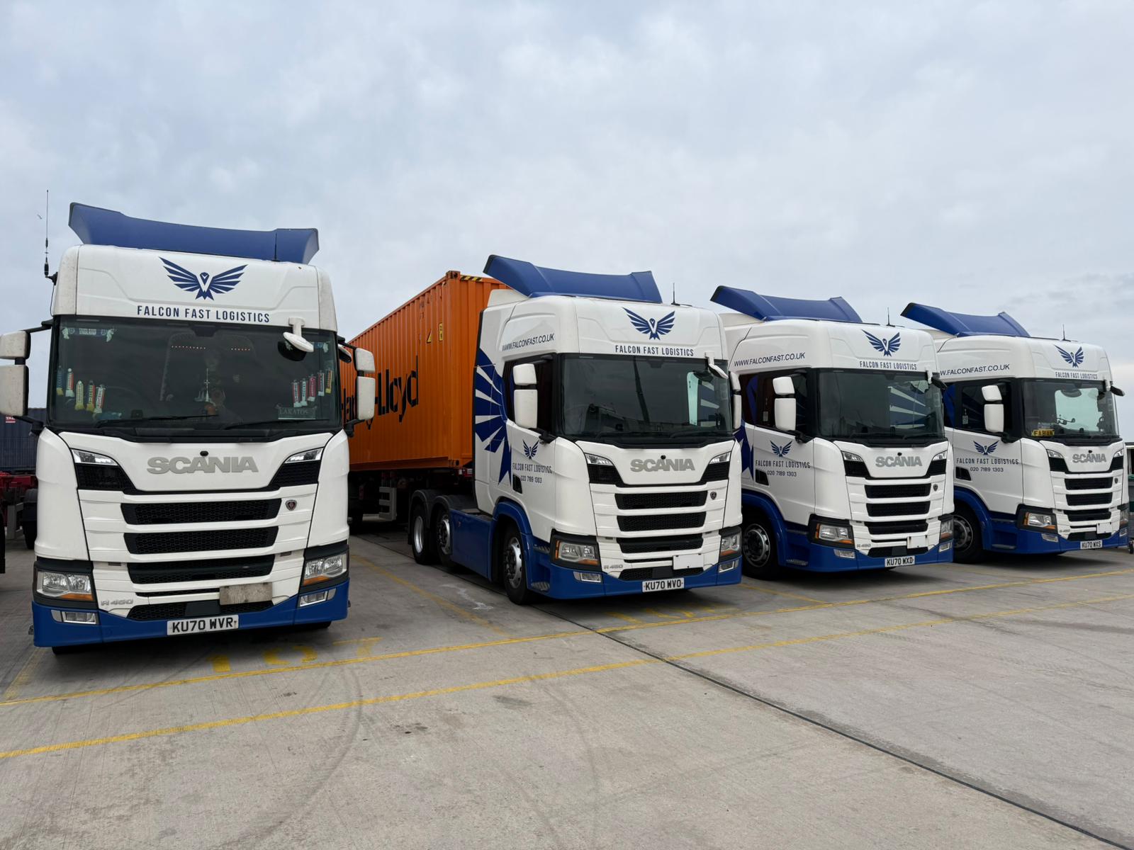 Falcon Fast Logistics trucks with a Hapag-Lloyd container at the depot