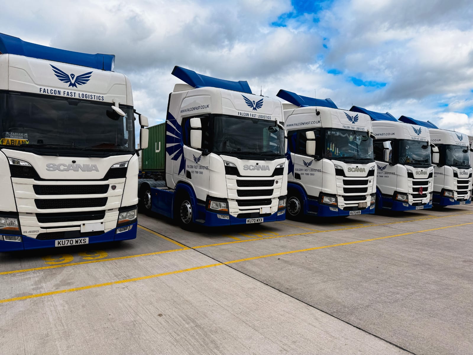 Falcon Fast Logistics Scania fleet lined up under a clear blue sky