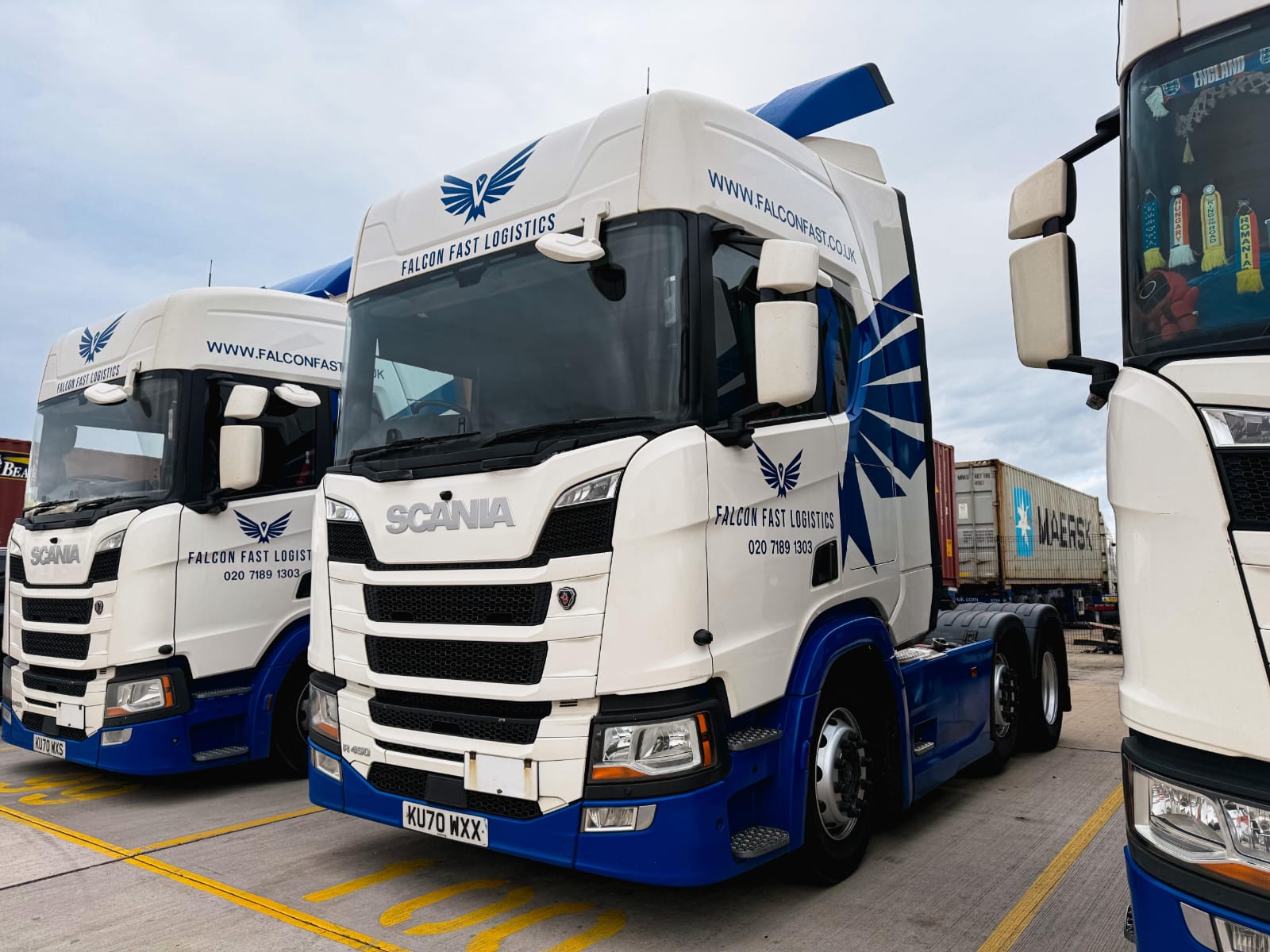 Falcon Fast Logistics Scania tractor units beside a Maersk container