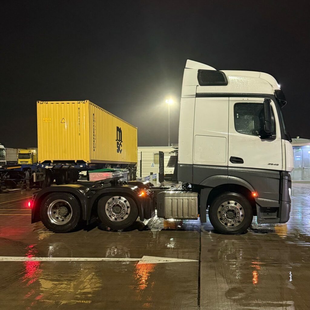 Falcon tractor unit and container trailer on night shift