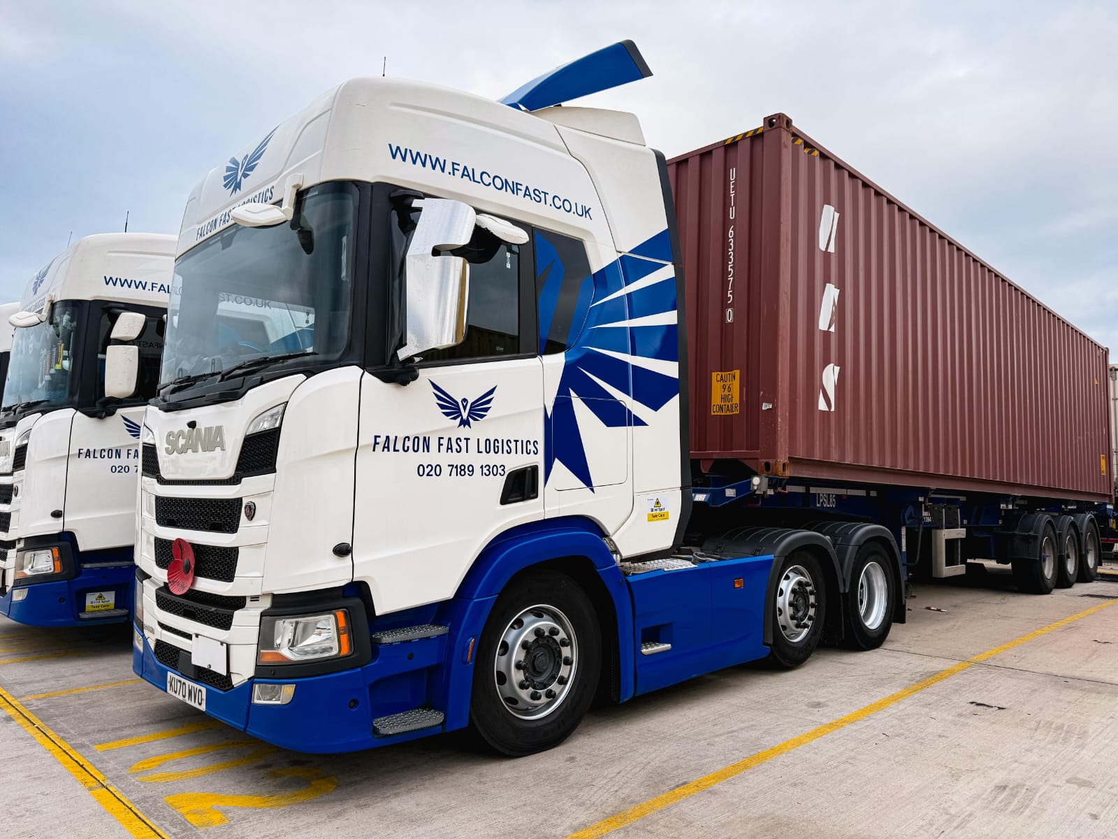Falcon Fast Logistics Scania loaded with a shipping container at the depot